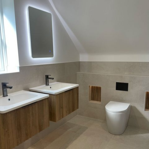 bathroom tiles twin sinks toilet illuminated mirror