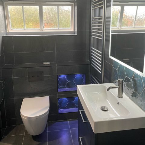 sink toilet radiator mirror tiled