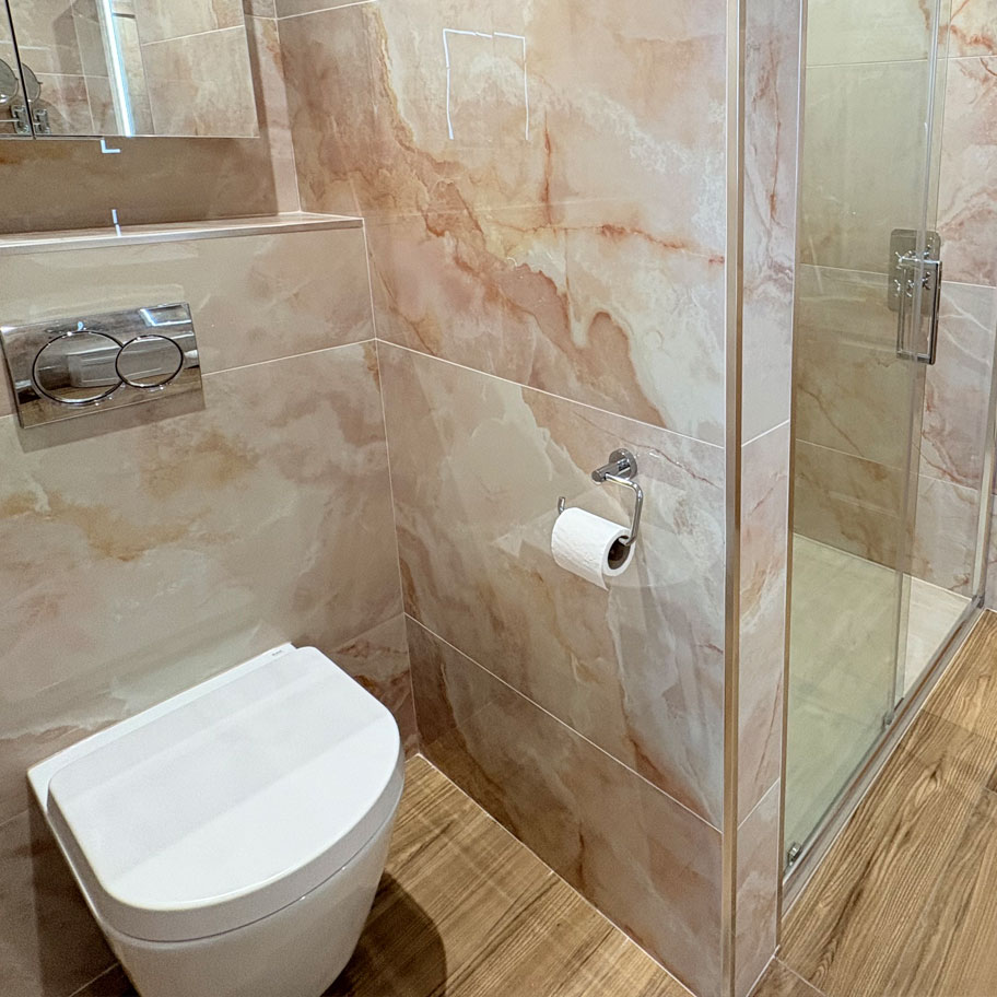 walk in shower room sink tiling mirror toilet